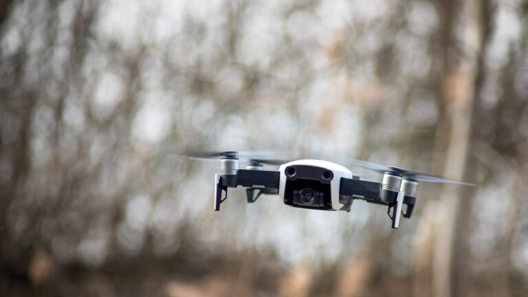 An autonomous drone in flight against an open sky